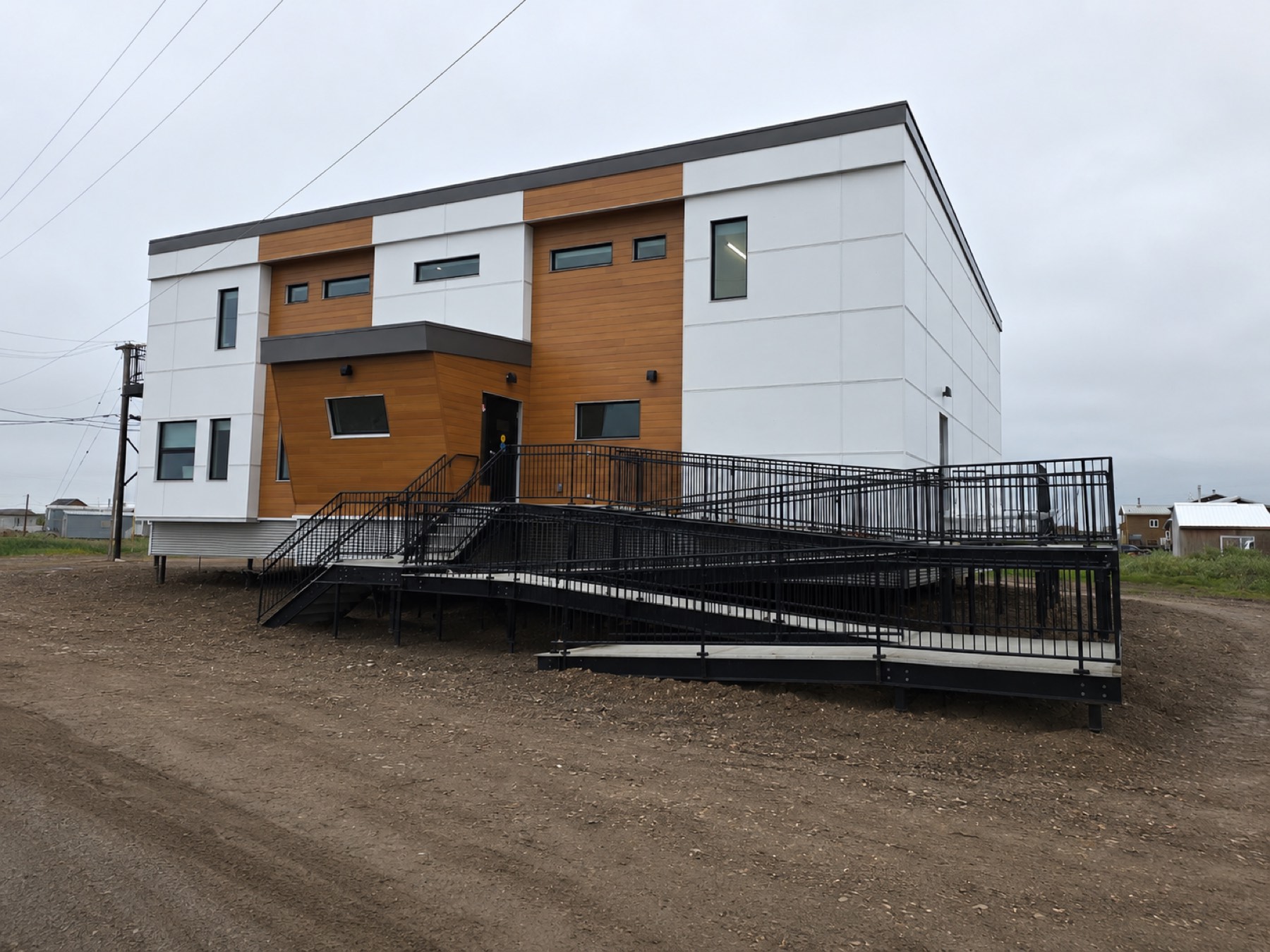 Completed modular building with a steel access ramp after a site installation