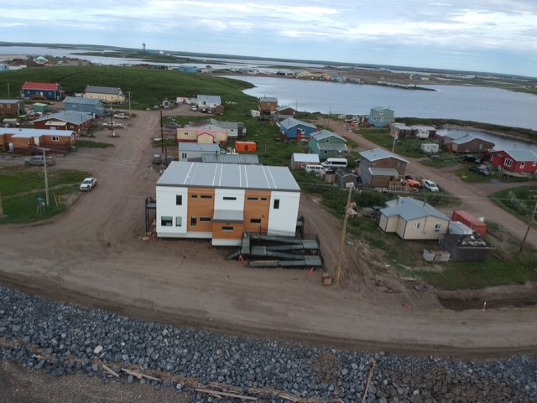 Dusk aerial view of a modular building project in a Northern Canada community